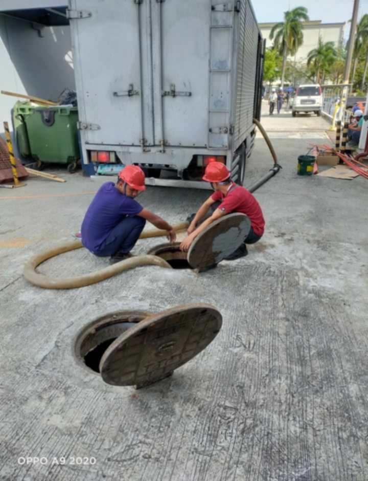 Malabanan Siphoning Services Team Operational Truck on Worksite